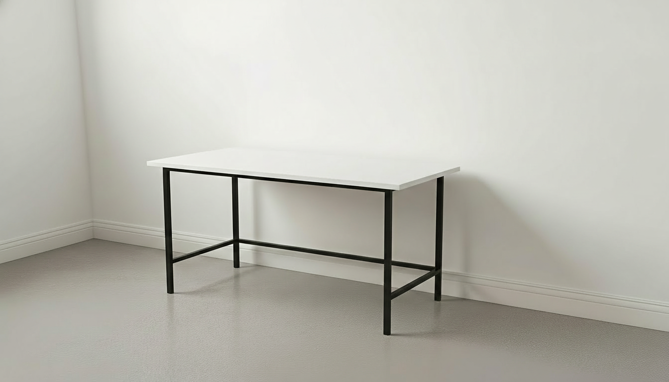 White desk with black legs against a plain white wall